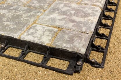 Barkman Concrete Snap Edge installation with paving stones, available at Ron Paul Garden Centre, designed for secure and durable landscape edging.